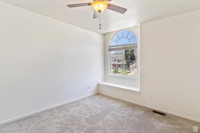 677 E 2900 N, North Ogden, UT 84414 - spare room featuring carpet flooring, a ceiling fan, and a textured ceiling