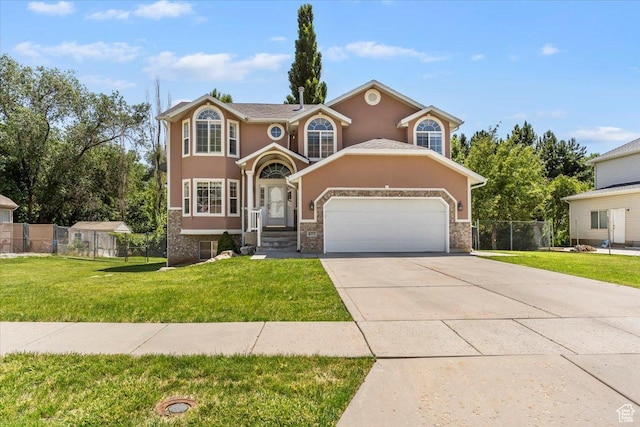 677 E 2900 N, North Ogden, UT 84414 - traditional-style home with an attached garage, stucco siding, and driveway