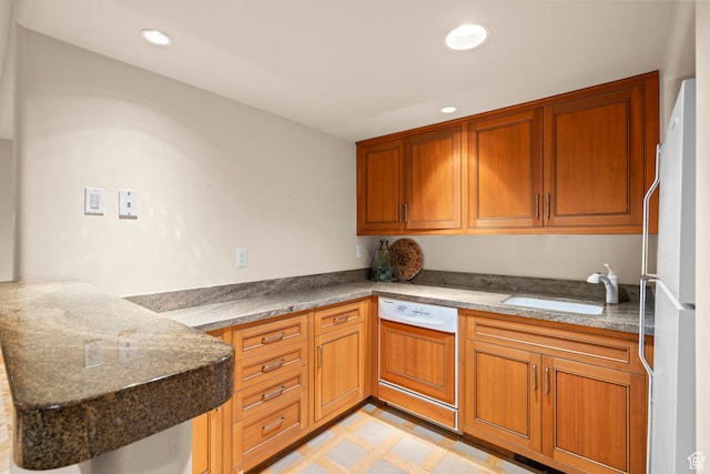 6033 S 2300 E, Holladay, UT 84121 - kitchen featuring dishwasher, brown cabinetry, freestanding refrigerator, and recessed lighting