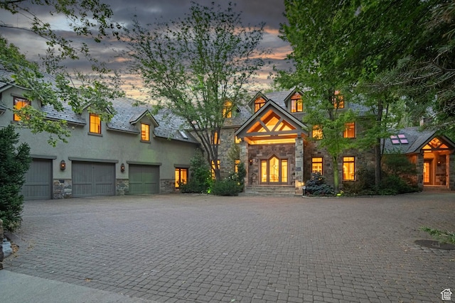 6033 S 2300 E, Holladay, UT 84121 - view of front facade featuring stone siding, decorative driveway, and stucco siding