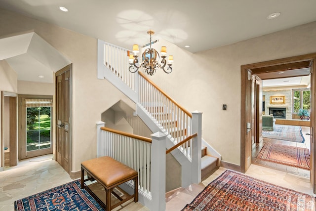 6033 S 2300 E, Holladay, UT 84121 - stairs featuring a chandelier, a large fireplace, and recessed lighting