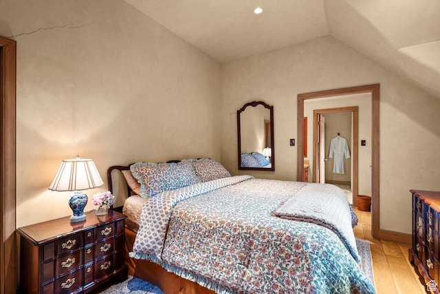 6033 S 2300 E, Holladay, UT 84121 - bedroom with vaulted ceiling and light wood-style floors