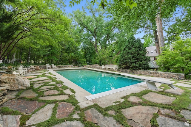 6033 S 2300 E, Holladay, UT 84121 - swimming pool with a patio and view of wooded area