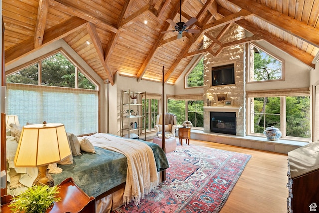 6033 S 2300 E, Holladay, UT 84121 - bedroom with high vaulted ceiling, a wood ceiling with exposed beams, wood finished floors, a fireplace, and multiple windows