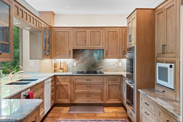 6033 S 2300 E, Holladay, UT 84121 - kitchen with white appliances, light stone counters, tasteful backsplash, light wood-style floors, and recessed lighting