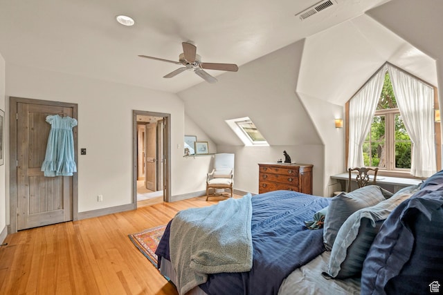 6033 S 2300 E, Holladay, UT 84121 - bedroom with lofted ceiling, light wood finished floors, a ceiling fan, and a skylight