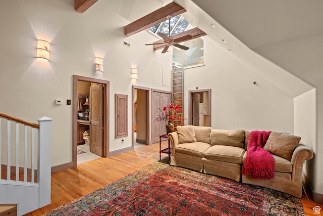 6033 S 2300 E, Holladay, UT 84121 - living area with light wood-style floors, high vaulted ceiling, a ceiling fan, and beam ceiling