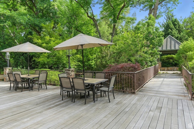 6033 S 2300 E, Holladay, UT 84121 - deck with outdoor dining space and view of wooded area