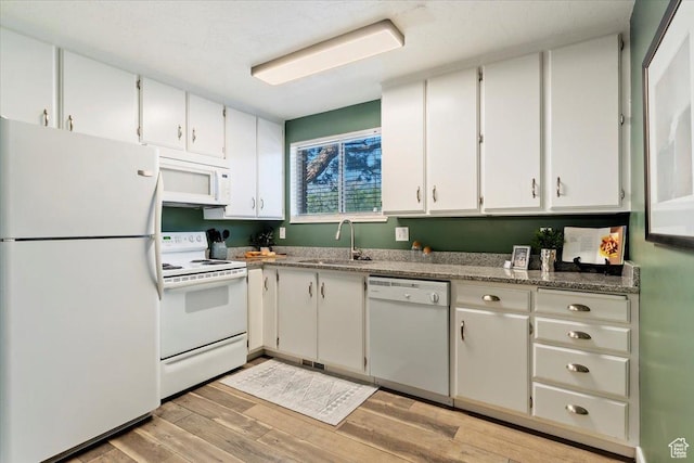 1263 E Cottonwood Hills Dr S, Sandy, UT 84094 - kitchen with white appliances, light wood finished floors, and white cabinets