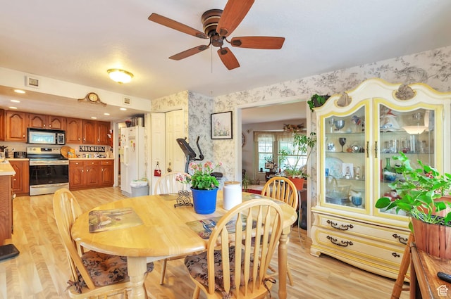 1162 N Newport Ln E, Kaysville, UT 84037 - dining room featuring wallpapered walls, light wood finished floors, and ceiling fan
