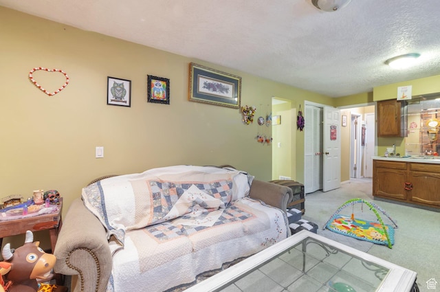 1162 N Newport Ln E, Kaysville, UT 84037 - living area featuring a textured ceiling and light colored carpet