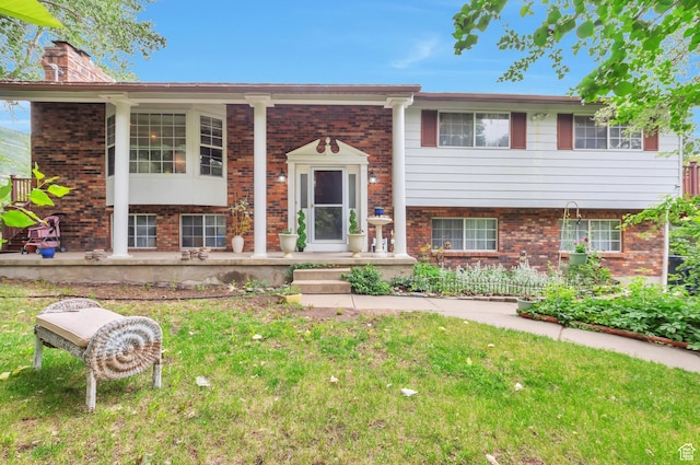 1162 N Newport Ln E, Kaysville, UT 84037 - bi-level home featuring brick siding, a front lawn, and covered porch