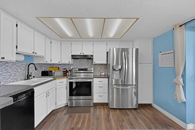 3684 W 4625 S, Roy, UT 84067 - kitchen with stainless steel appliances, dark wood-style flooring, under cabinet range hood, and backsplash
