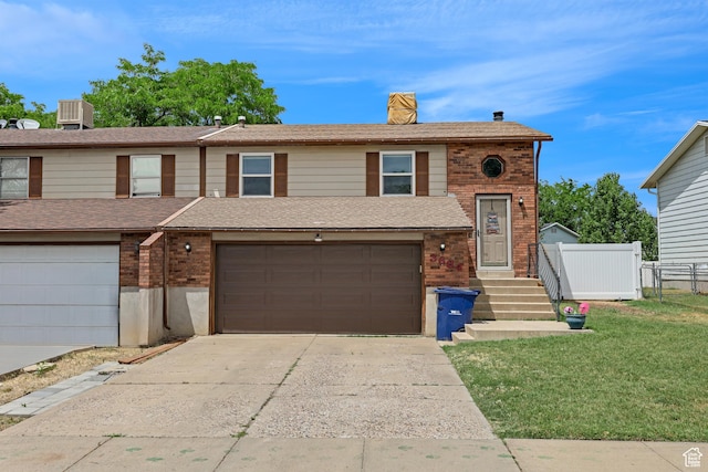 3684 W 4625 S, Roy, UT 84067 - view of front facade with brick siding, concrete driveway, a garage, a chimney, and roof with shingles