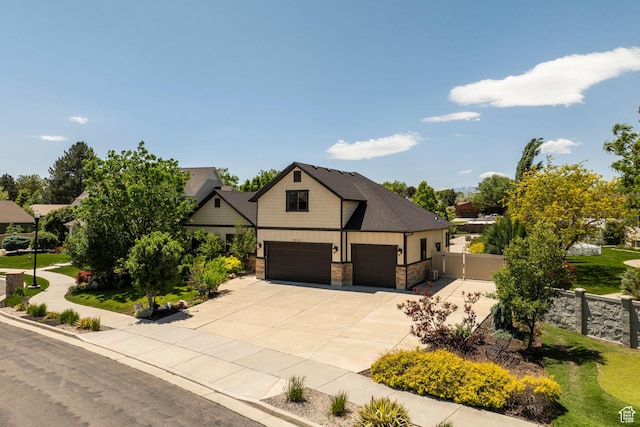 9532 S Willow Trail Way S, Jordan, UT 84095 - view of front of property featuring driveway, stone siding, a garage, and board and batten siding