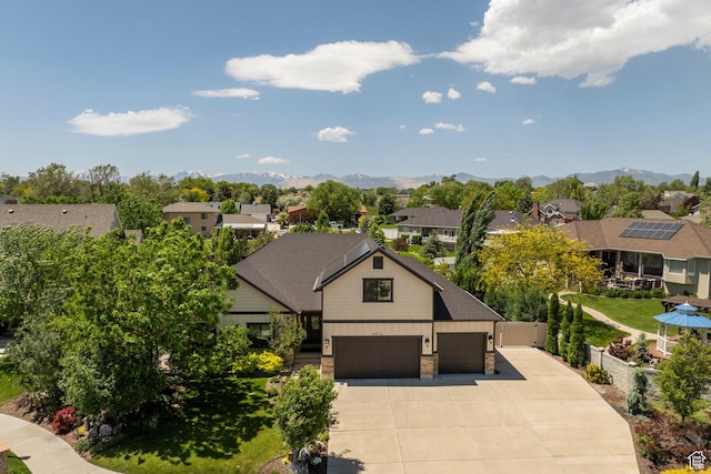 9532 S Willow Trail Way S, Jordan, UT 84095 - view of front of house with driveway, a residential view, an attached garage, and a mountain view
