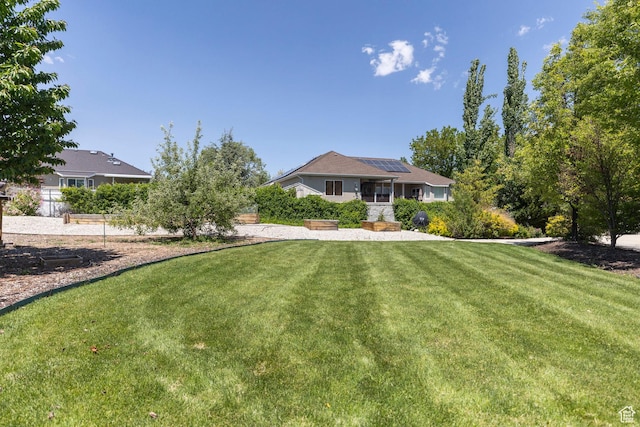 9532 S Willow Trail Way S, Jordan, UT 84095 - view of front of house with solar panels and a front lawn