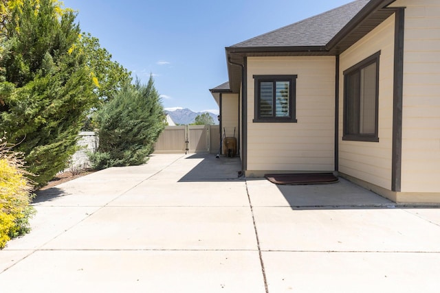 9532 S Willow Trail Way S, Jordan, UT 84095 - view of patio / terrace featuring a gate and a mountain view