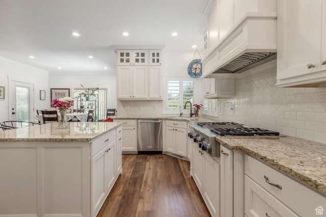 9532 S Willow Trail Way S, Jordan, UT 84095 - kitchen with stainless steel appliances, healthy amount of natural light, decorative backsplash, white cabinetry, and recessed lighting