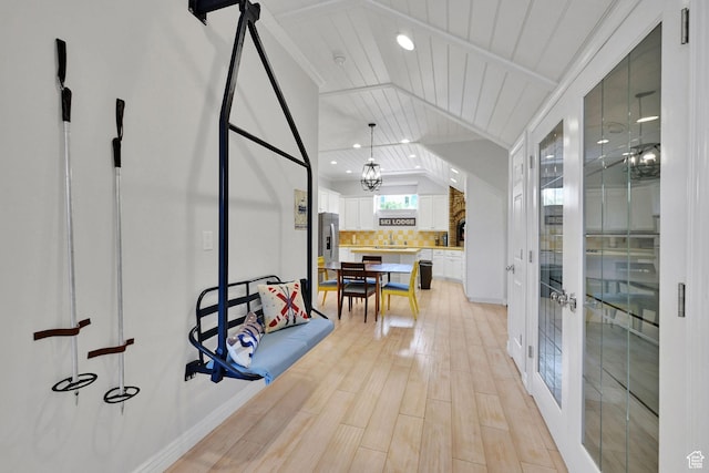 3990 Summer Ridge Rd, Morgan, UT 84050 - corridor featuring french doors, vaulted ceiling, light wood finished floors, and recessed lighting