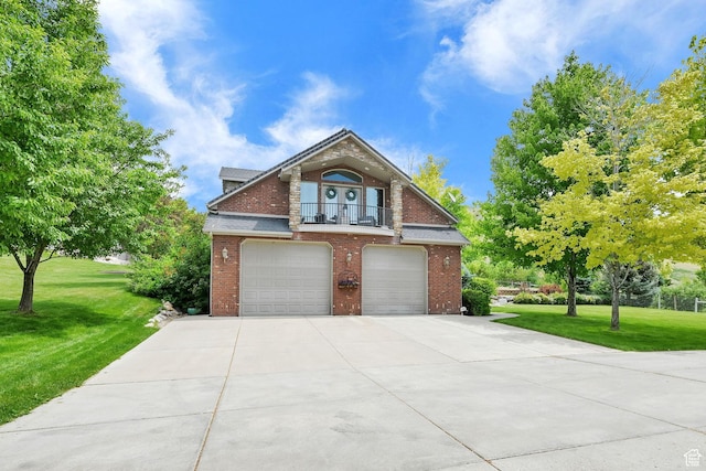 3990 Summer Ridge Rd, Morgan, UT 84050 - view of front facade featuring an attached garage, brick siding, concrete driveway, a front yard, and a balcony