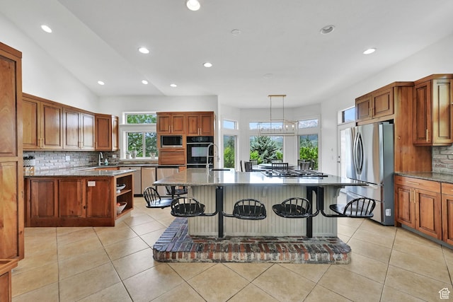 3990 Summer Ridge Rd, Morgan, UT 84050 - kitchen with stainless steel appliances, a kitchen breakfast bar, decorative backsplash, recessed lighting, and open shelves