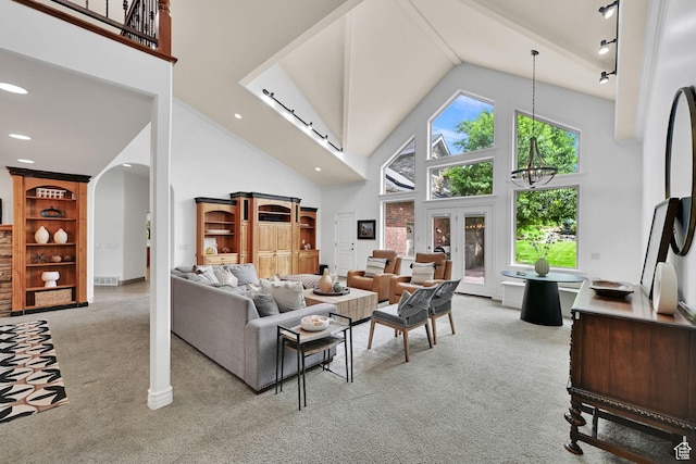 3990 Summer Ridge Rd, Morgan, UT 84050 - living area with carpet floors, high vaulted ceiling, arched walkways, and a chandelier