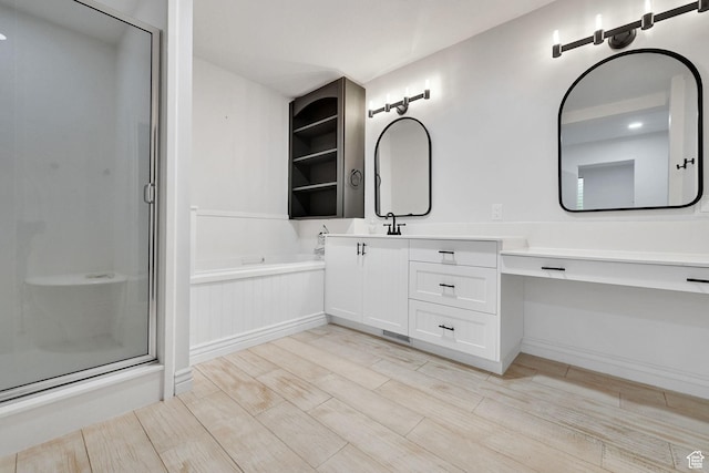 3990 Summer Ridge Rd, Morgan, UT 84050 - full bathroom with a stall shower, vanity, wood finished floors, and a garden tub