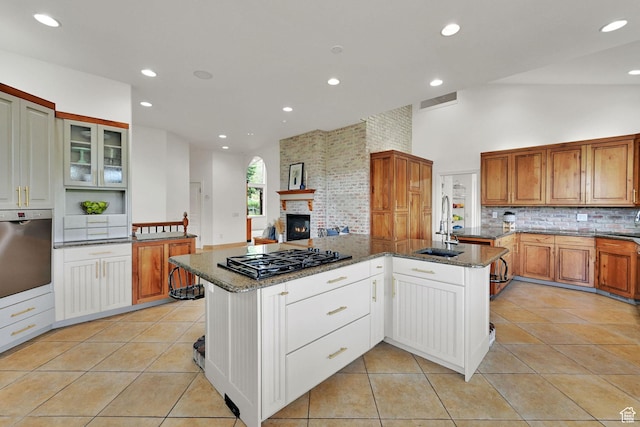 3990 Summer Ridge Rd, Morgan, UT 84050 - kitchen featuring gas stovetop, backsplash, dark stone countertops, recessed lighting, and light tile patterned floors
