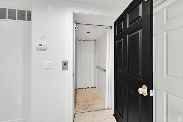 3990 Summer Ridge Rd, Morgan, UT 84050 - hallway featuring a heating unit and light wood-type flooring