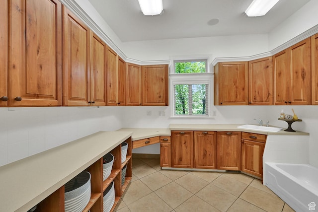 3990 Summer Ridge Rd, Morgan, UT 84050 - kitchen featuring brown cabinets, light tile patterned floors, and light countertops
