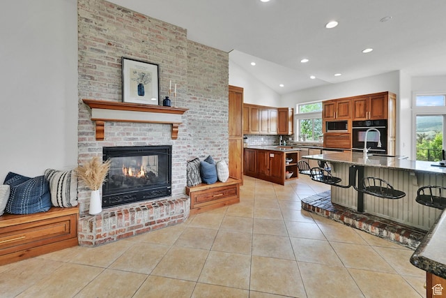 3990 Summer Ridge Rd, Morgan, UT 84050 - kitchen featuring oven, light tile patterned flooring, lofted ceiling, recessed lighting, and built in microwave