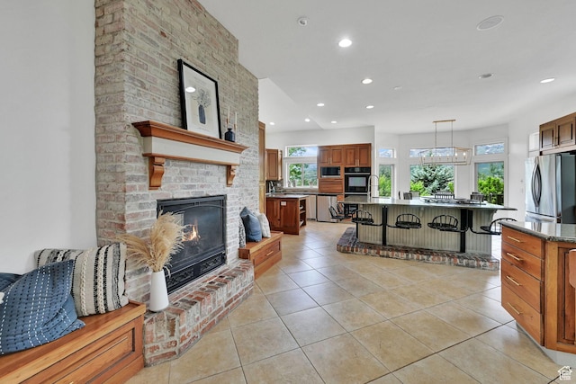 3990 Summer Ridge Rd, Morgan, UT 84050 - living area featuring recessed lighting, light tile patterned floors, and a brick fireplace