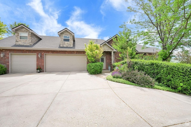 3990 Summer Ridge Rd, Morgan, UT 84050 - view of front facade with brick siding, concrete driveway, a garage, and roof with shingles