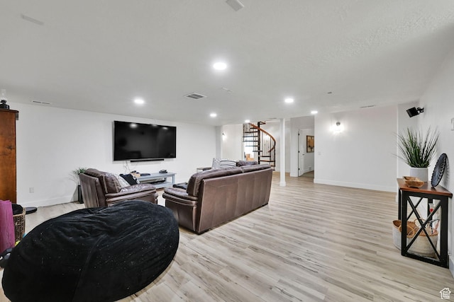 3990 Summer Ridge Rd, Morgan, UT 84050 - living room featuring stairs, light wood-style flooring, and recessed lighting
