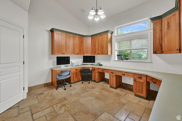 3990 Summer Ridge Rd, Morgan, UT 84050 - office area featuring built in study area, stone tile floors, lofted ceiling, and a chandelier
