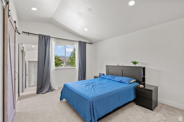 13082 S 2770th Cir W, Riverton, UT 84065 - bedroom with vaulted ceiling, light colored carpet, a barn door, and recessed lighting