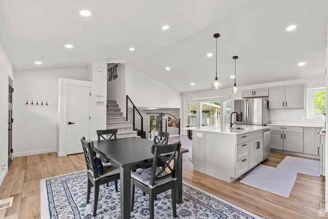 13082 S 2770th Cir W, Riverton, UT 84065 - dining area with stairs, light wood-style floors, vaulted ceiling, and recessed lighting