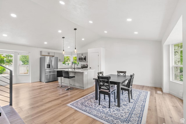 13082 S 2770th Cir W, Riverton, UT 84065 - dining area featuring vaulted ceiling, light wood-style floors, and recessed lighting