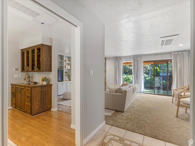 1411 E 1220 N, Logan, UT 84341 - corridor featuring light colored carpet and a textured ceiling