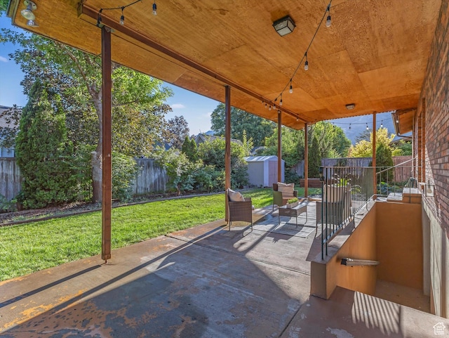 1411 E 1220 N, Logan, UT 84341 - fenced backyard with a storage shed and a patio