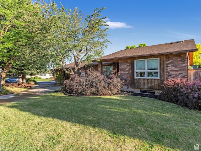 1411 E 1220 N, Logan, UT 84341 - view of front facade with a front lawn and brick siding
