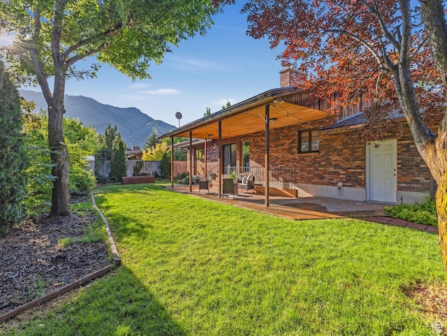 1411 E 1220 N, Logan, UT 84341 - view of yard featuring a patio and a mountain view