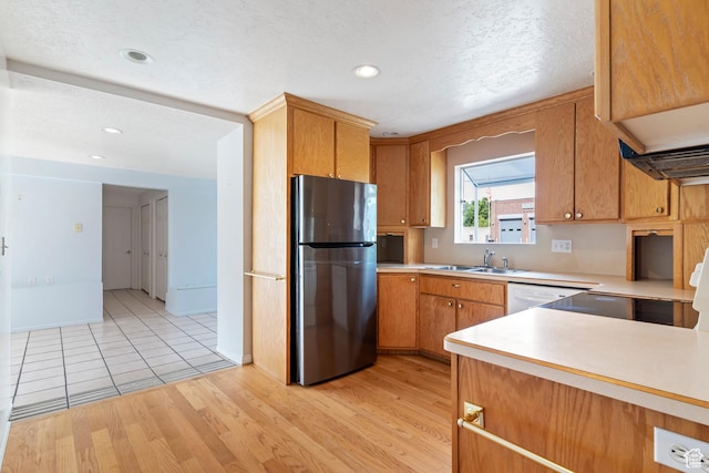430 E 100 N, Morgan, UT 84050 - kitchen featuring freestanding refrigerator, light countertops, light wood-style floors, recessed lighting, and a textured ceiling