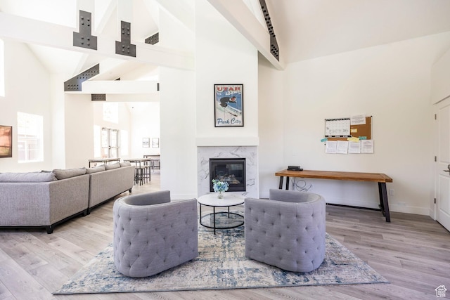 3249 Quarry Springs Dr, Park City, UT 84098 - living room featuring high vaulted ceiling, wood finished floors, a high end fireplace, and beam ceiling