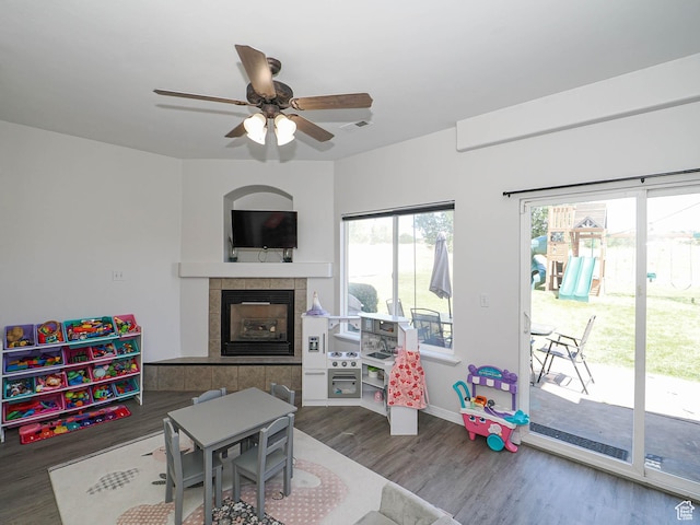 4242 W 11430 S, South Jordan, UT 84009 - recreation room with wood finished floors, ceiling fan, and a tiled fireplace