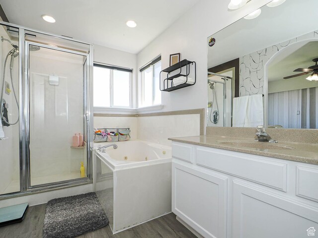 4242 W 11430 S, South Jordan, UT 84009 - full bathroom with wood finished floors, a stall shower, a jetted tub, vanity, and ceiling fan