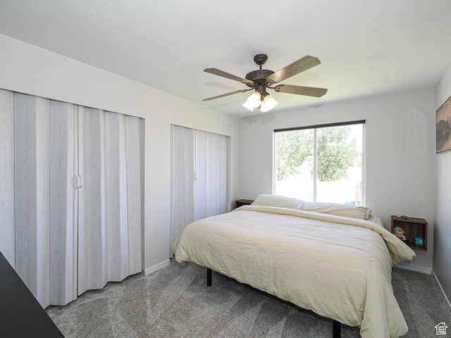 4242 W 11430 S, South Jordan, UT 84009 - bedroom with carpet, a ceiling fan, and two closets