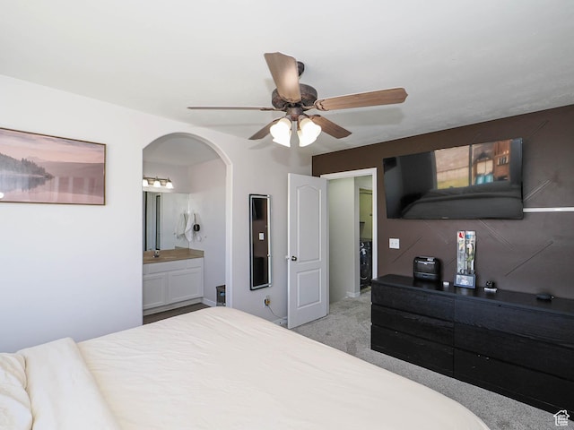 4242 W 11430 S, South Jordan, UT 84009 - bedroom with arched walkways, connected bathroom, light carpet, and ceiling fan