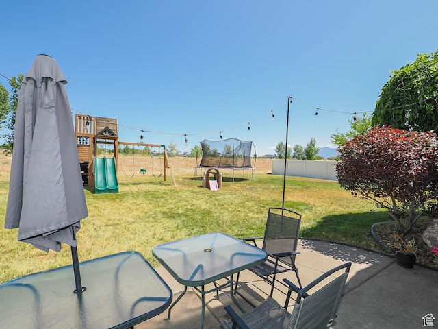 4242 W 11430 S, South Jordan, UT 84009 - fenced backyard featuring a playground, a trampoline, and a patio area